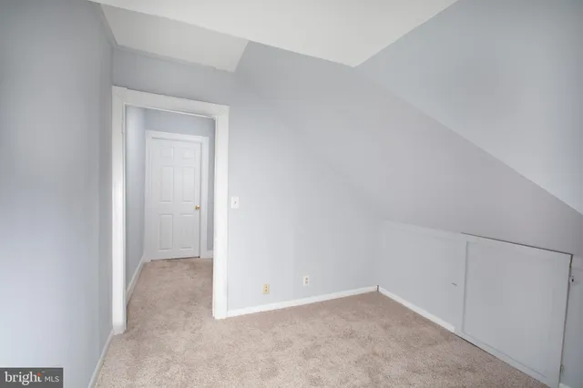 a view of an empty room and entryway