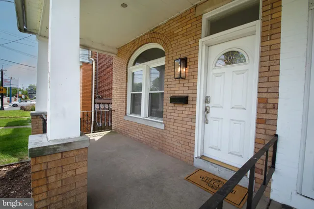 a front view of a house with parking space