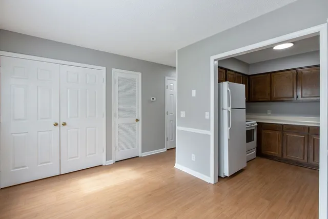 a kitchen with stainless steel appliances a refrigerator and a stove top oven