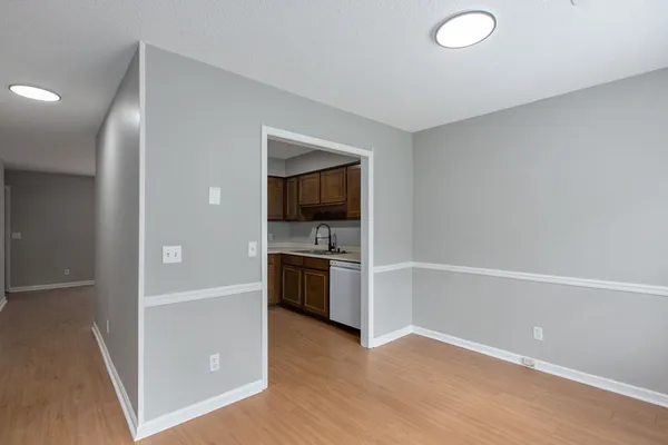 a view of a kitchen with a sink stove and cabinet