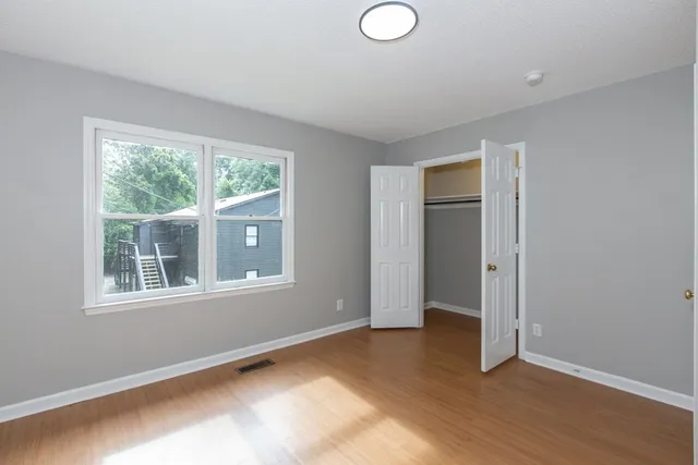 a view of an empty room with a window