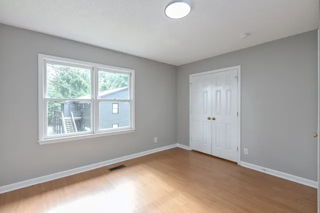 a view of an empty room with a window