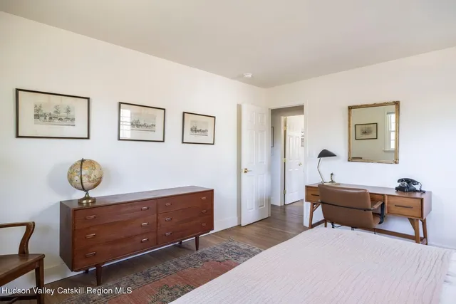 a bedroom with a bed and furniture