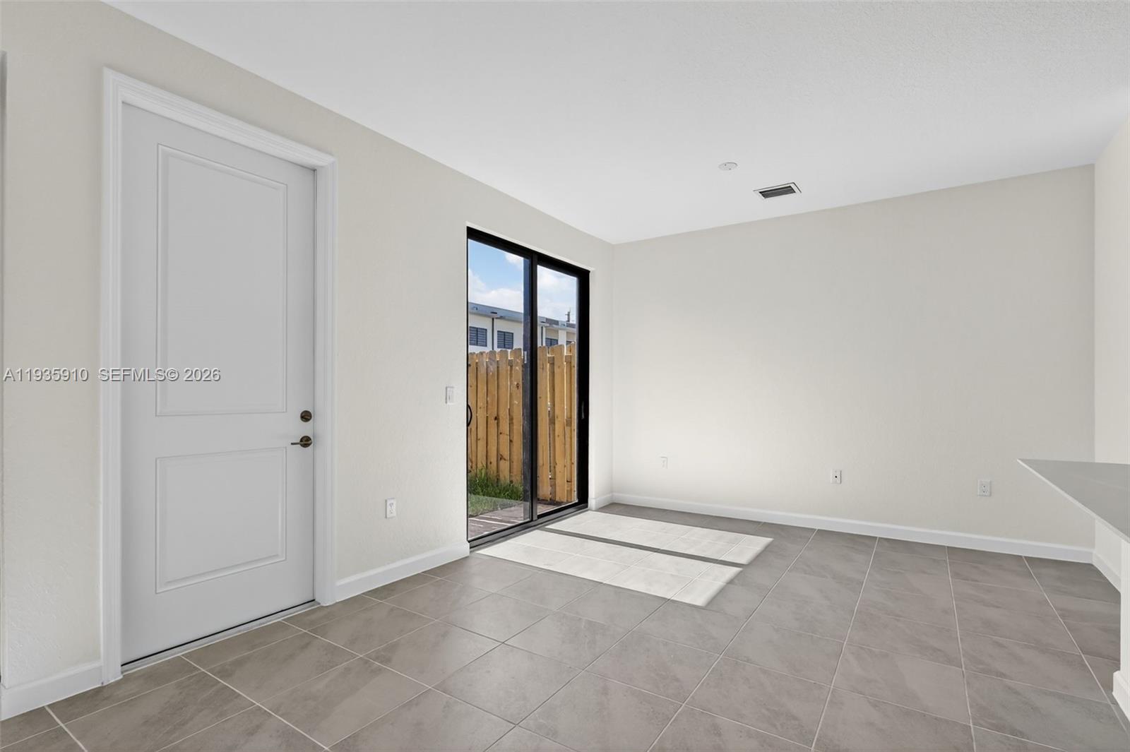 13872 Southwest 262nd Street, Unit 13862 Homestead, FL 33032 - Photo 17 of 43 a view of an empty room