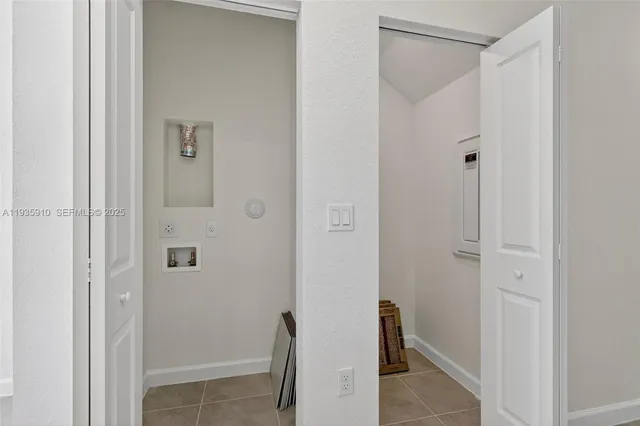 a bathroom with a shower and a door