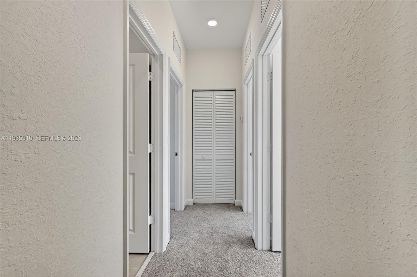 13872 Southwest 262nd Street, Unit 13862 Homestead, FL 33032 - Photo 23 of 43 a view of a hallway with closet area