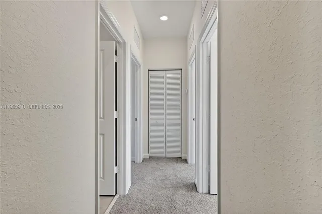 a view of a hallway with closet area