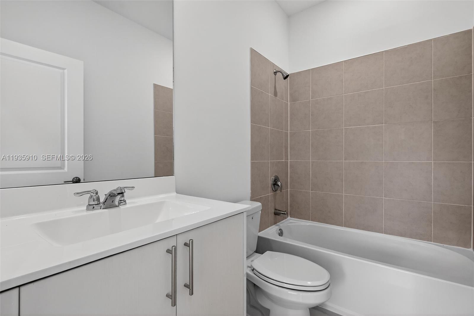 13872 Southwest 262nd Street, Unit 13862 Homestead, FL 33032 - Photo 25 of 43 a bathroom with a sink a toilet and shower