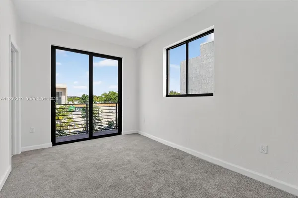 an empty room with windows