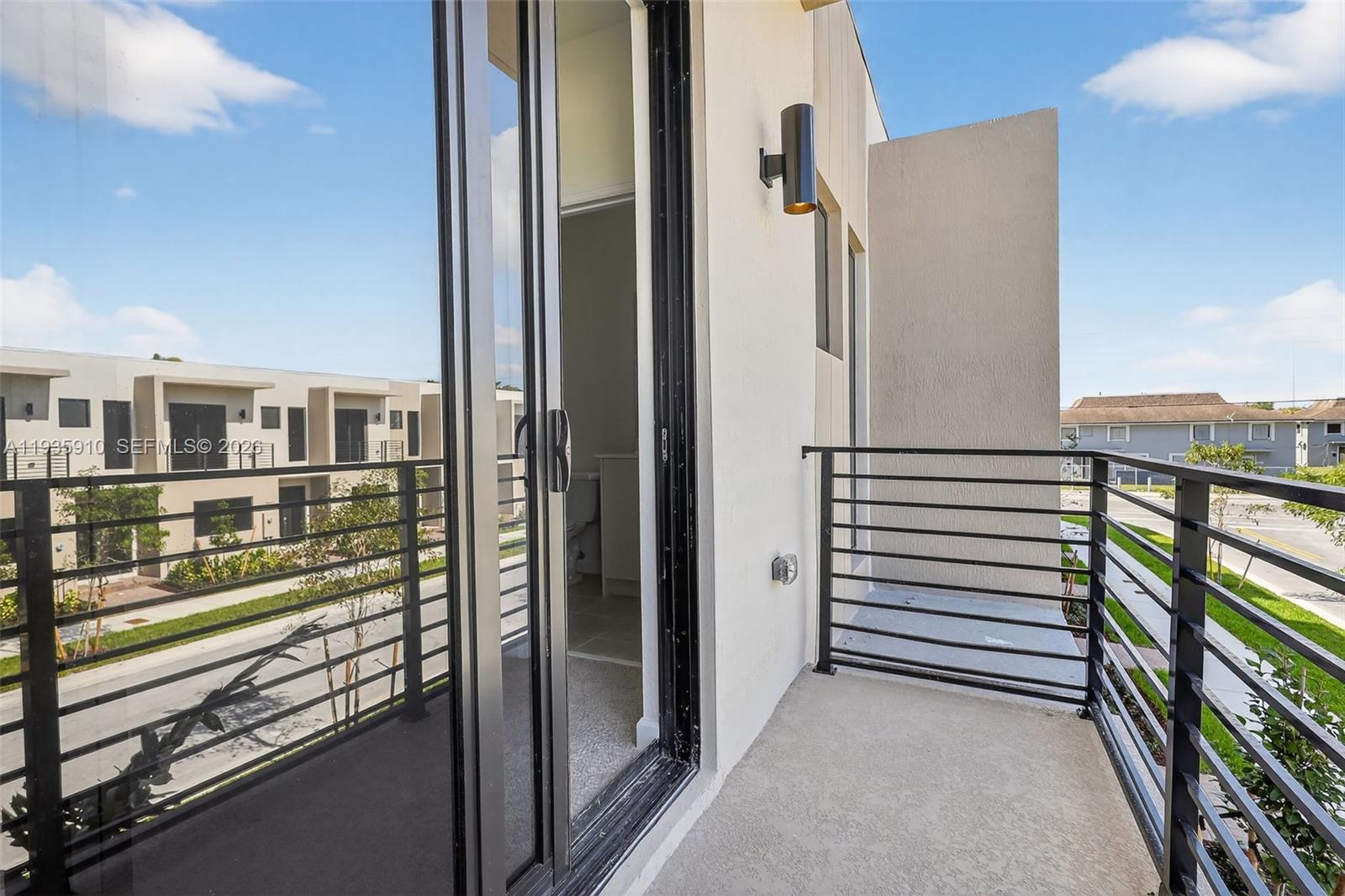 13872 Southwest 262nd Street, Unit 13862 Homestead, FL 33032 - Photo 37 of 43 a view of a balcony from door