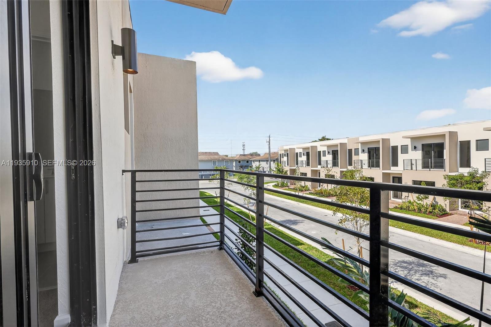13872 Southwest 262nd Street, Unit 13862 Homestead, FL 33032 - Photo 38 of 43 a view of a balcony with two chairs