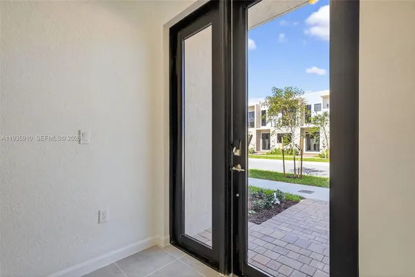 a view of hallway with wooden floor