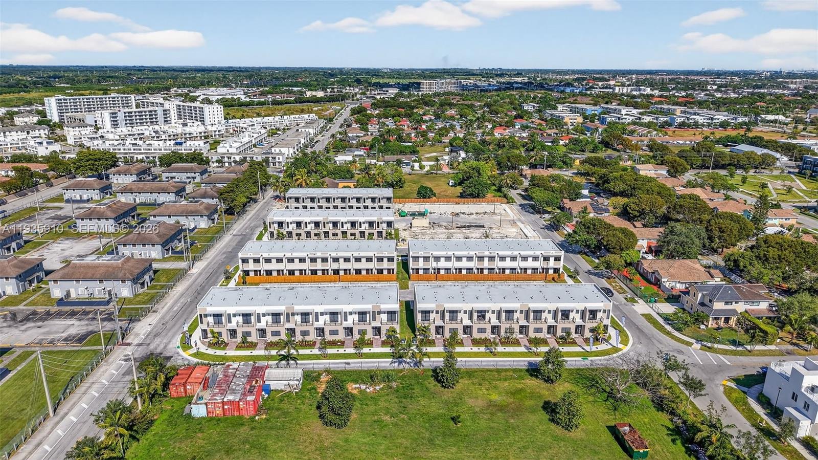 13872 Southwest 262nd Street, Unit 13862 Homestead, FL 33032 - Photo 42 of 43 an aerial view of multiple houses with yard