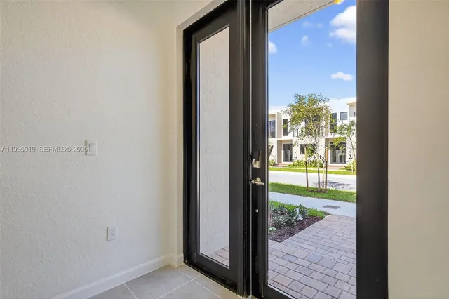 a view of hallway with wooden floor