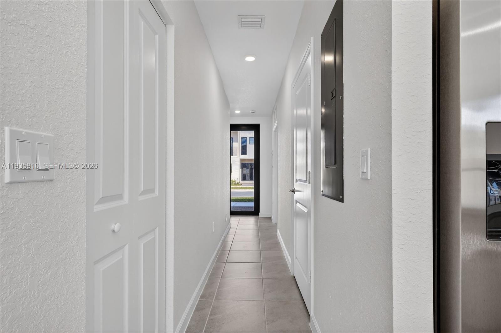 13872 Southwest 262nd Street, Unit 13862 Homestead, FL 33032 - Photo 5 of 43 a view of a hallway with wooden floor