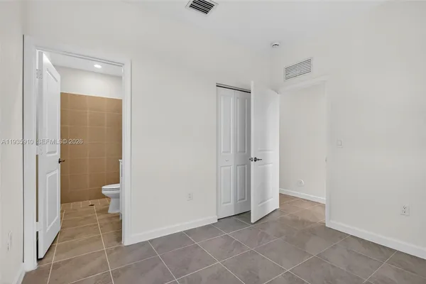 a view of a bathroom with a shower and a toilet