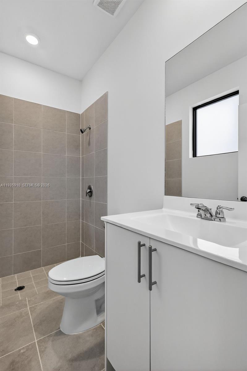 13872 Southwest 262nd Street, Unit 13862 Homestead, FL 33032 - Photo 9 of 43 a bathroom with a sink toilet and shower