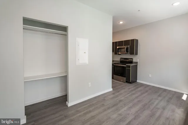 a view of kitchen and wooden floor