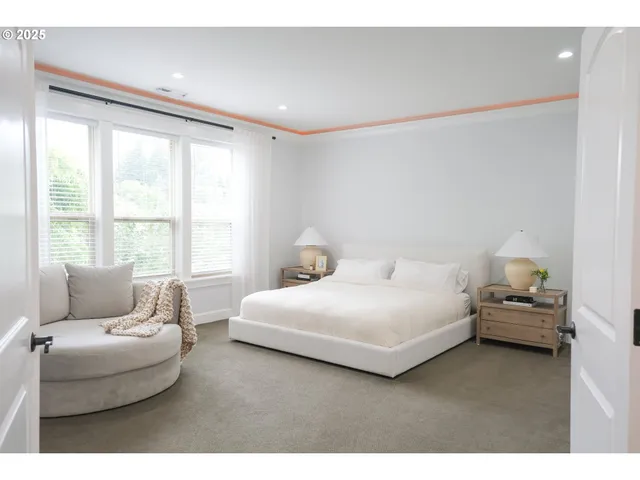 a bedroom with a bed and a couch