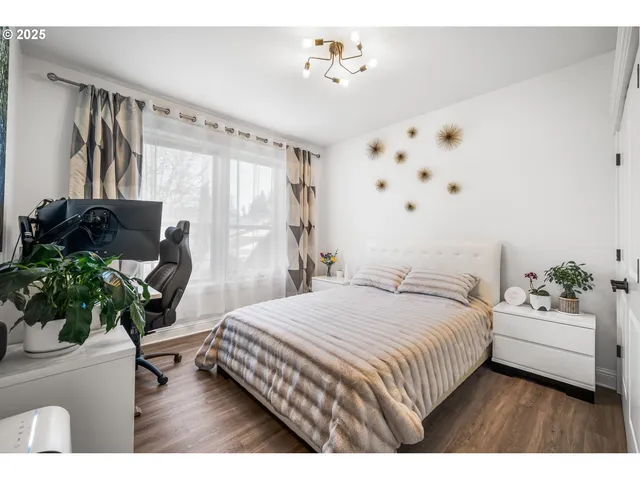 a bedroom with a bed furniture and a window