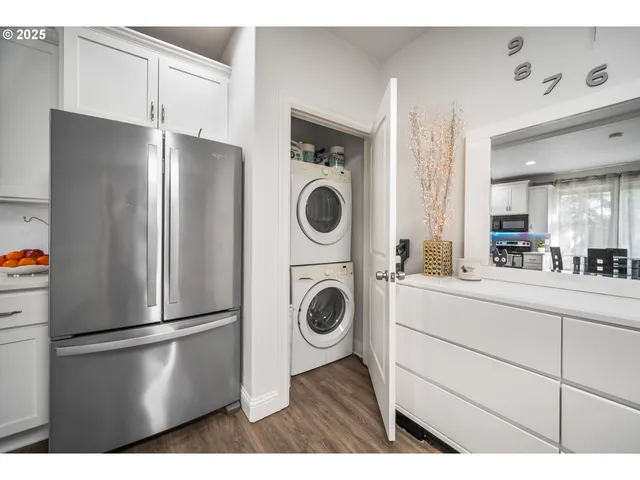 a kitchen with a refrigerator and cabinets