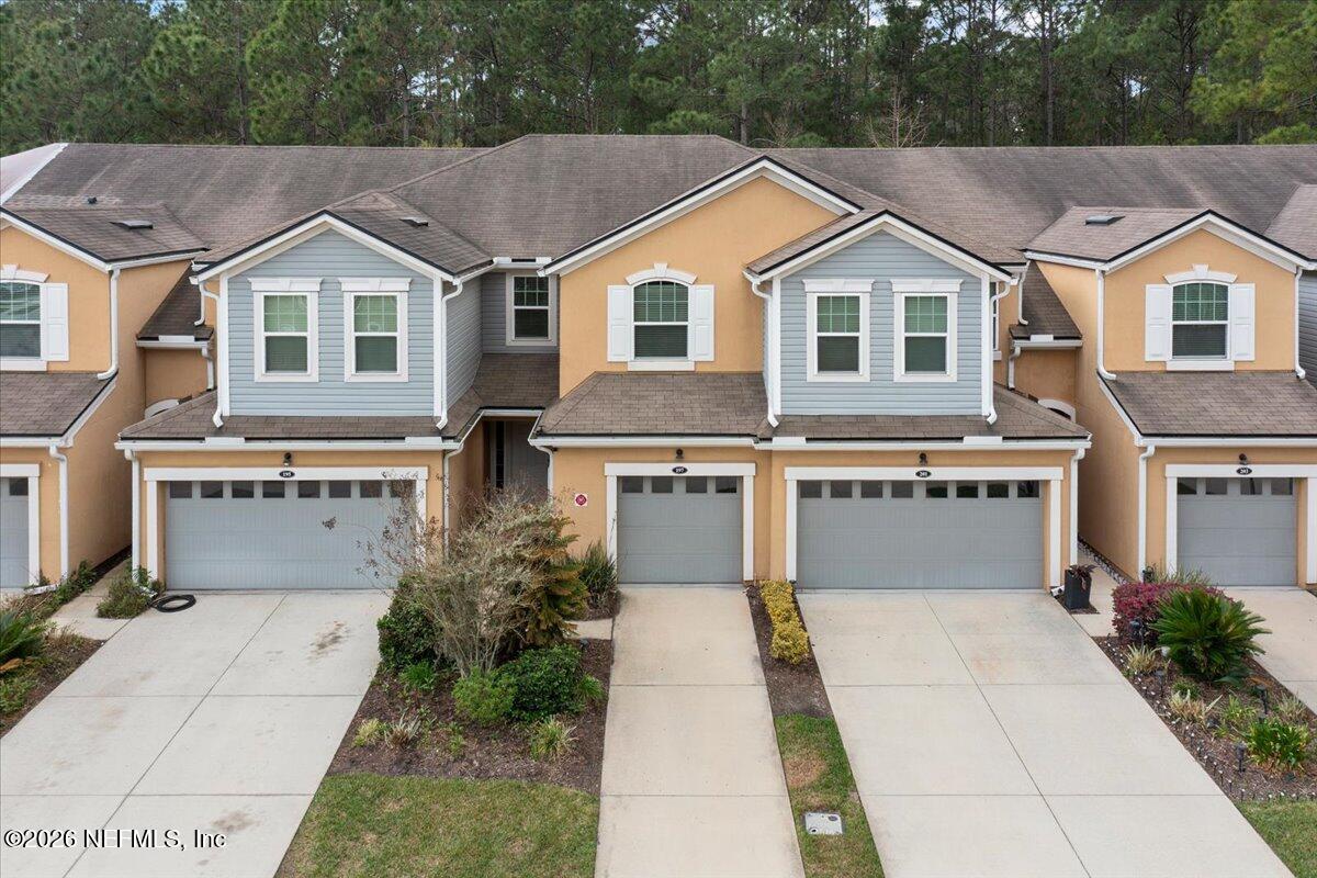 197 Paradas Place St. Augustine, FL 32092 - Photo 2 of 46 a view of residential houses with yard and trees in the background