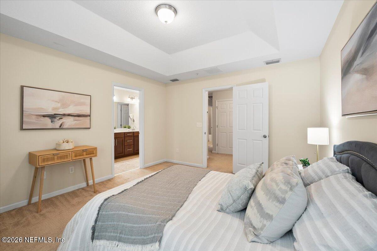 197 Paradas Place St. Augustine, FL 32092 - Photo 21 of 46 a bedroom with a bed and wooden floor