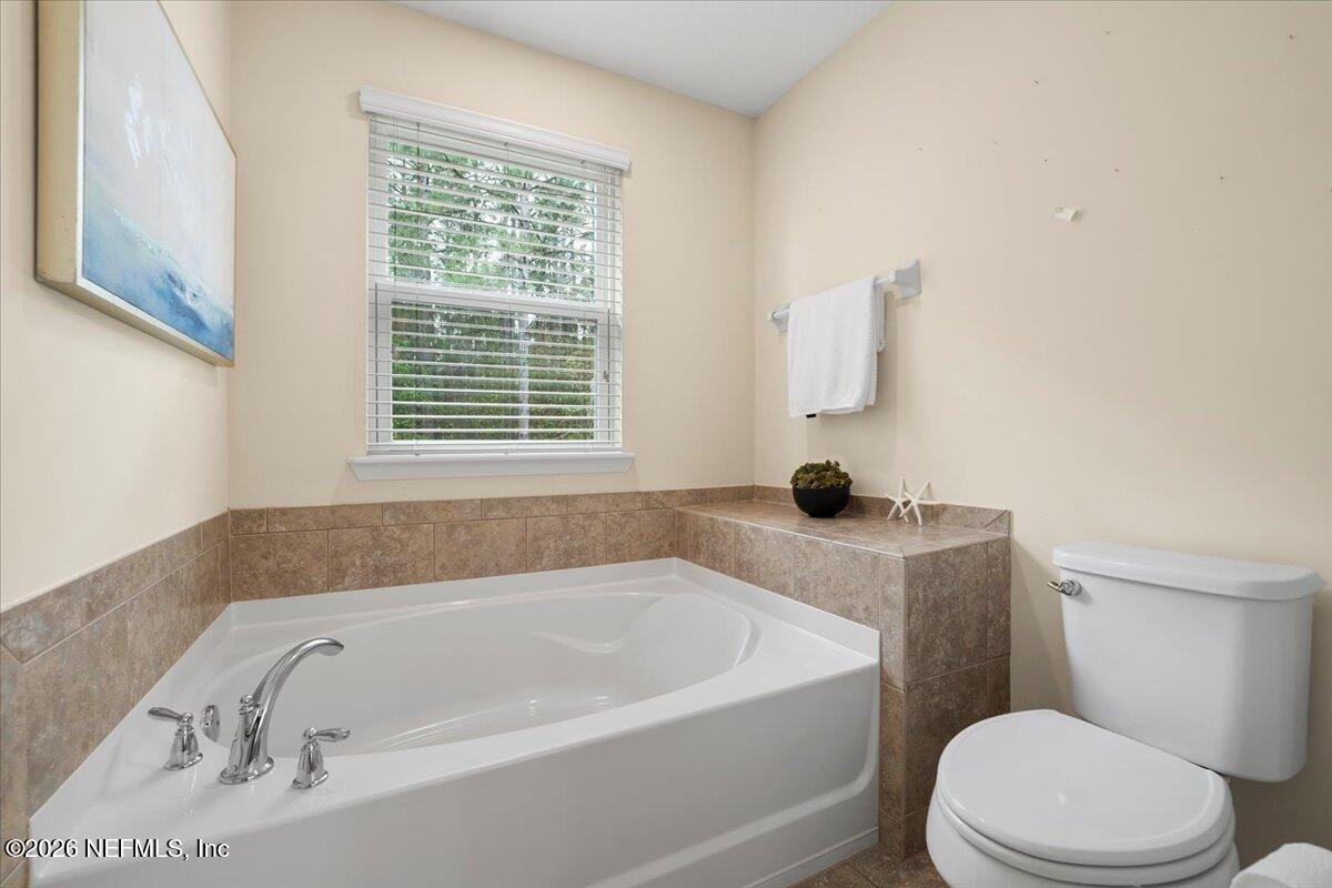 197 Paradas Place St. Augustine, FL 32092 - Photo 24 of 46 a white bath tub sitting next to a toilet