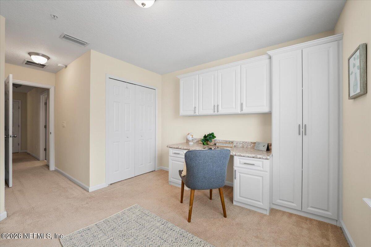 197 Paradas Place St. Augustine, FL 32092 - Photo 29 of 46 a workspace with a computer on the desk chairs