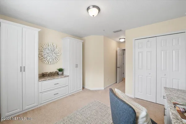 a room with a bed and a window