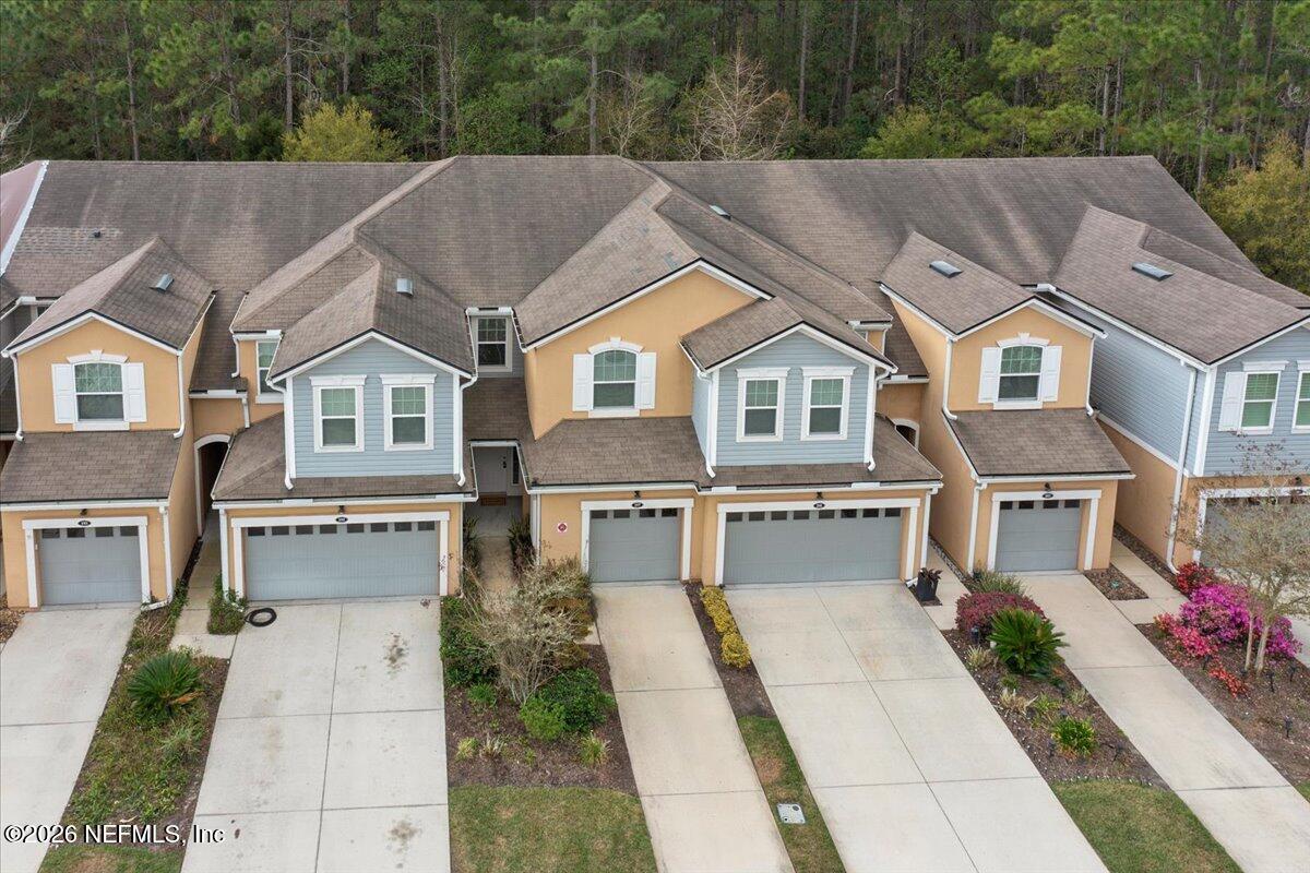 197 Paradas Place St. Augustine, FL 32092 - Photo 3 of 46 a aerial view of a house with a yard and potted plants