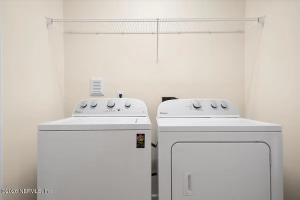 a utility room with dryer and washer
