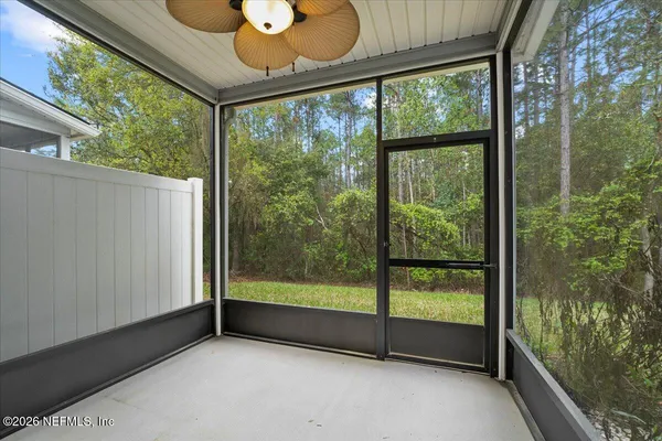 a view of room with a large window and floor to ceiling window