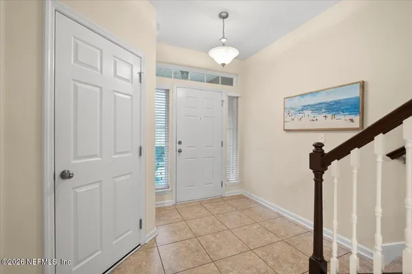 a view of an entryway with a flower pot