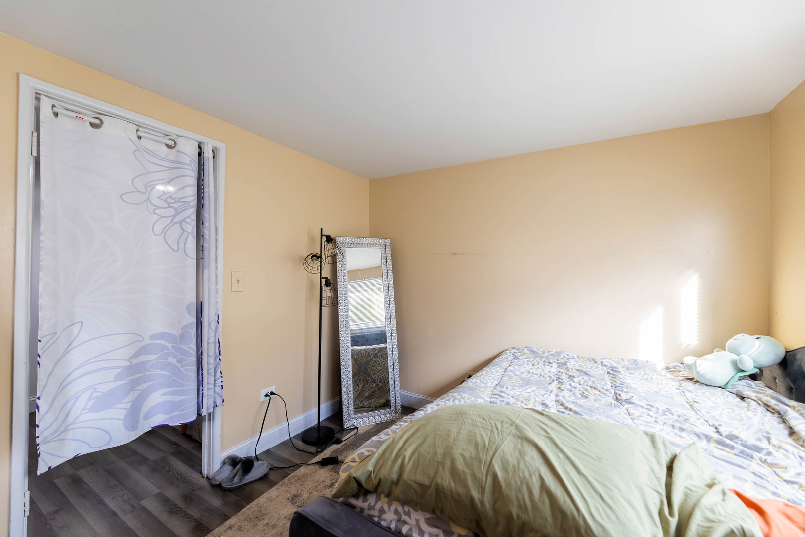 9207 South Halsted Street Chicago, IL 60620 - Photo 11 of 17 a bedroom with a bed and wooden floor
