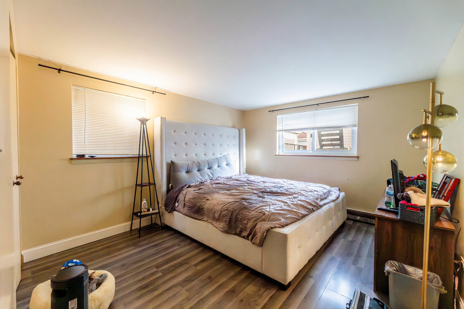 9207 South Halsted Street Chicago, IL 60620 - Photo 12 of 17 a bedroom with a bed and wooden floor