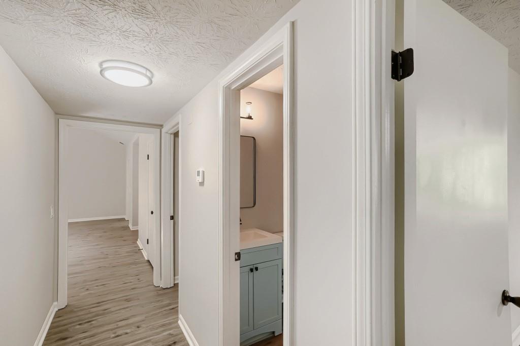 2021 Irwin Bridge Road Northwest Conyers, GA 30012 - Photo 9 of 43 a view of a bathroom from a hallway