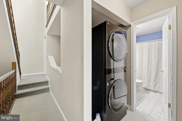 a bathroom with granite countertop a sink and a mirror