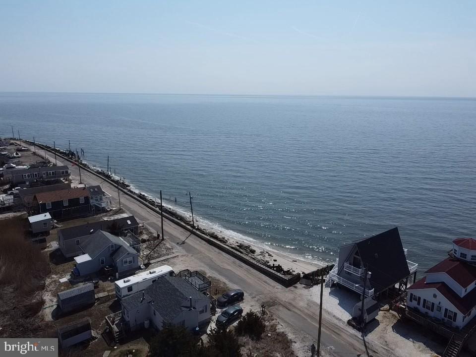 184 Cove Road Newport, NJ 08345 - Photo 24 of 41 a view of a ocean with a building