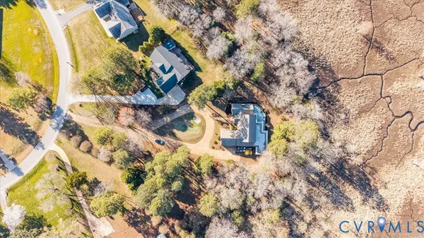 a pathway of a house with a yard