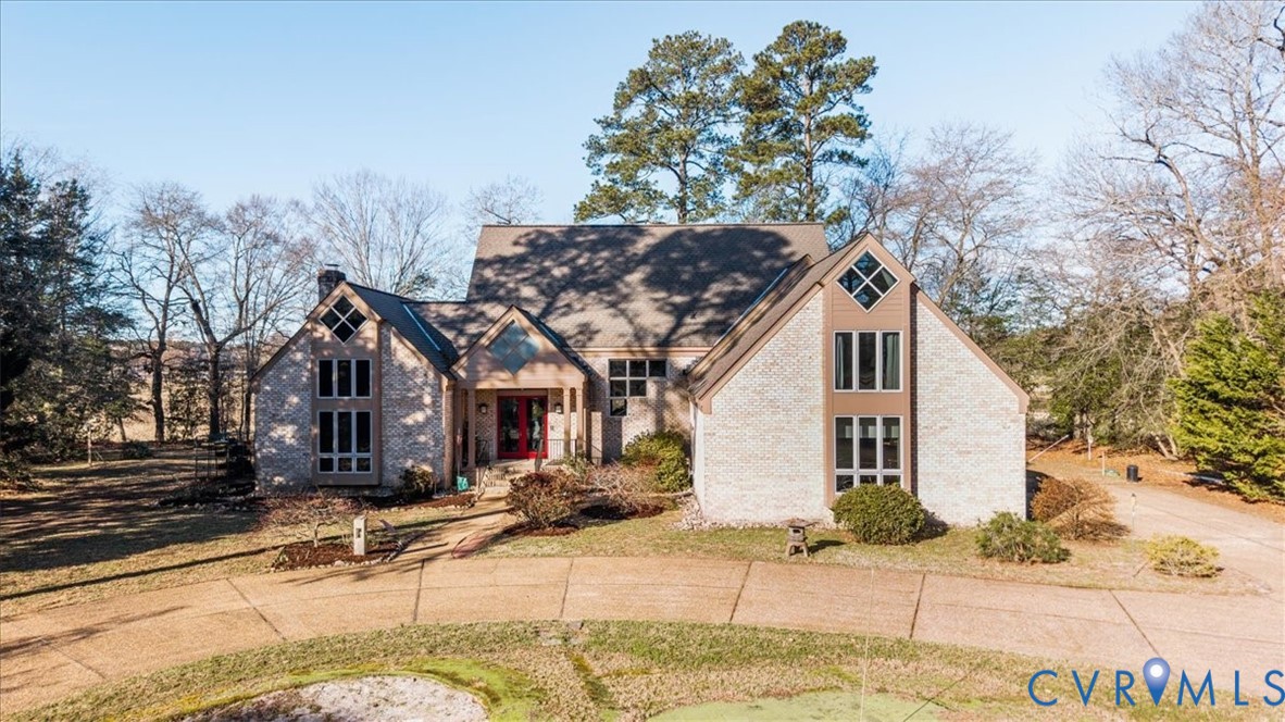 276 Colony Trail Lanexa, VA 23089 - Photo 2 of 39 a view of a house with a tree in the background