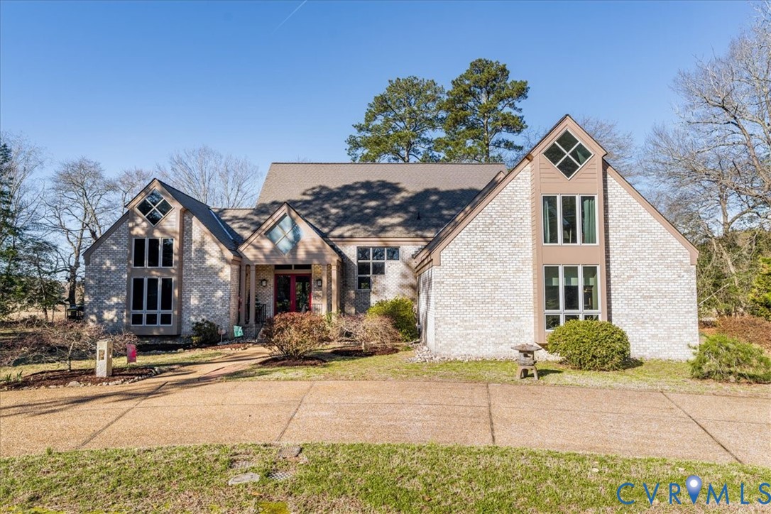 276 Colony Trail Lanexa, VA 23089 - Photo 25 of 39 a front view of a house with a yard and garage