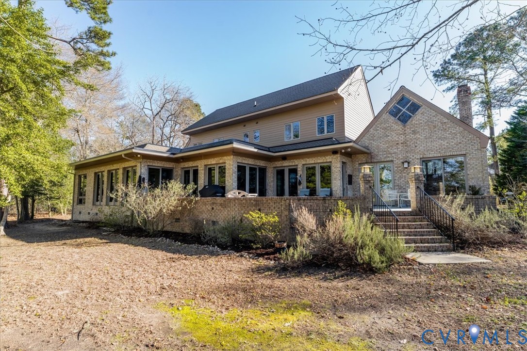 276 Colony Trail Lanexa, VA 23089 - Photo 32 of 39 a front view of a house with a yard and garage