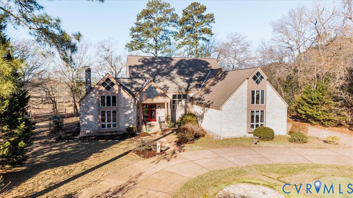 276 Colony Trail Lanexa, VA 23089 - Photo 4 of 39 a view of a white house with a yard covered in snow