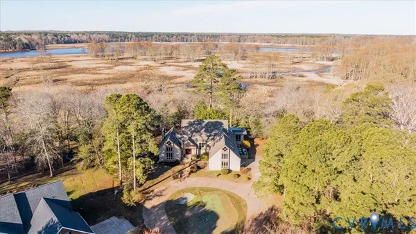 an aerial view of residential building and lake