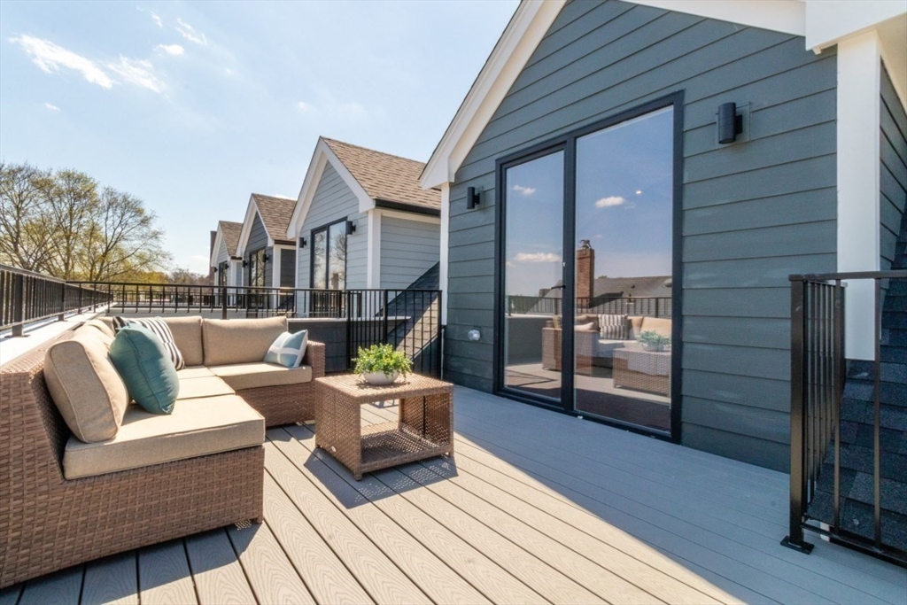 15 Tanglewood Road, Unit A Boston, MA 02126 - Photo 13 of 28 a outdoor living space with patio furniture and wooden floor