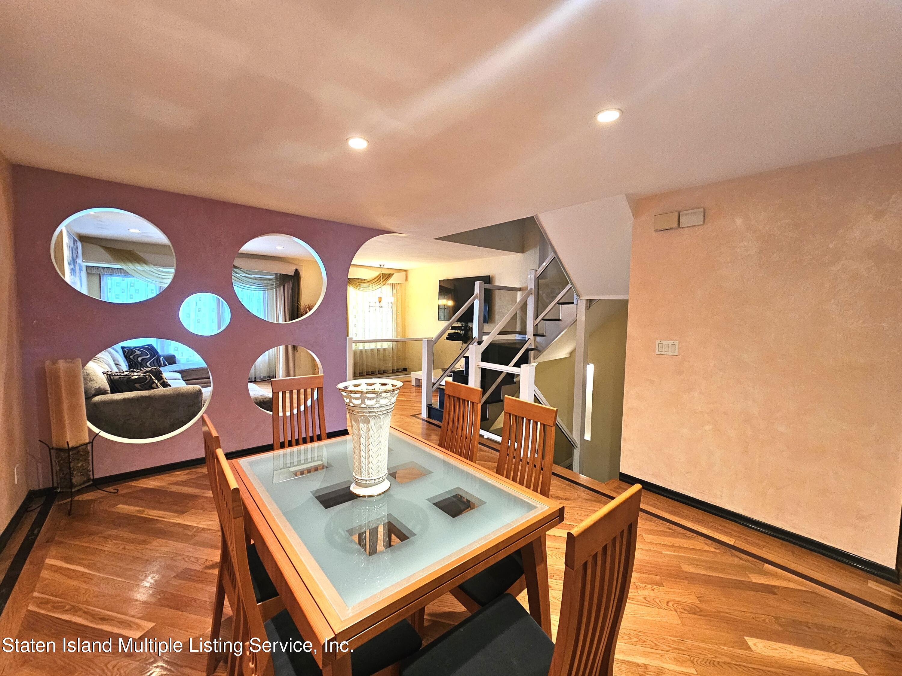 142 Commodore Drive Staten Island, NY 10309 - Photo 12 of 26 a view of a living room and dining room