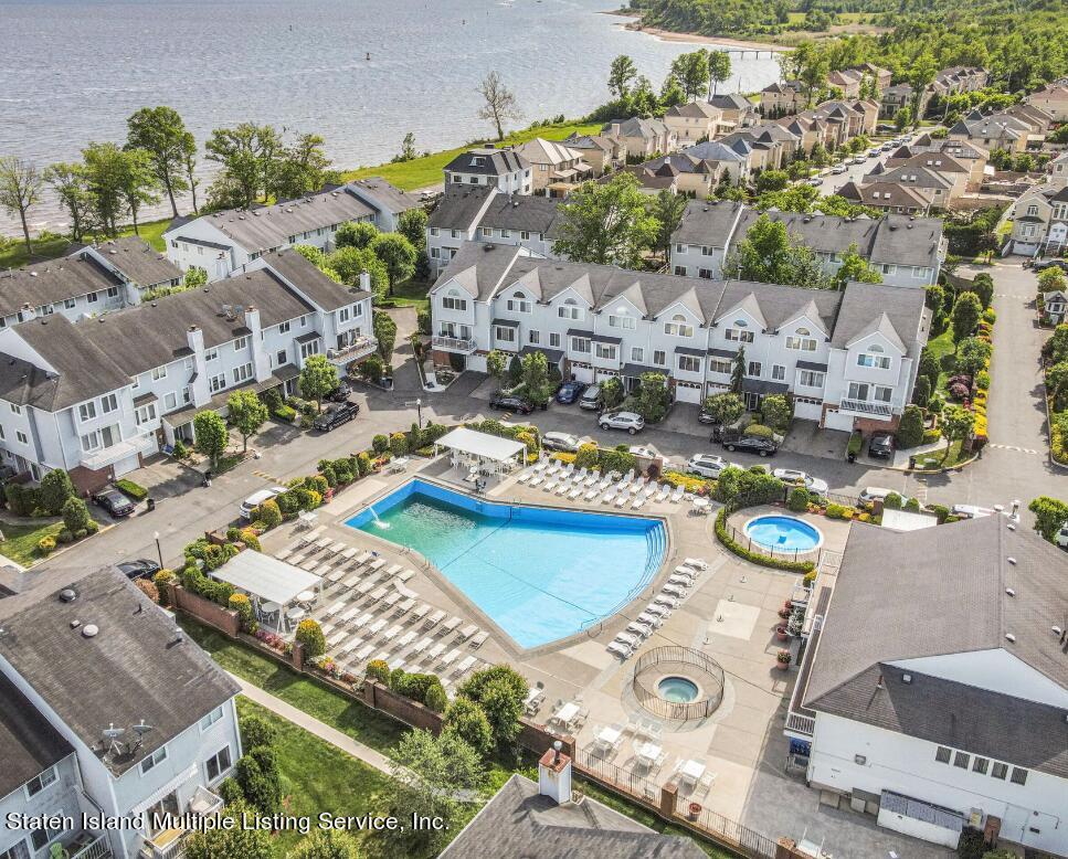 142 Commodore Drive Staten Island, NY 10309 - Photo 24 of 26 an aerial view of a swimming pool with outdoor seating