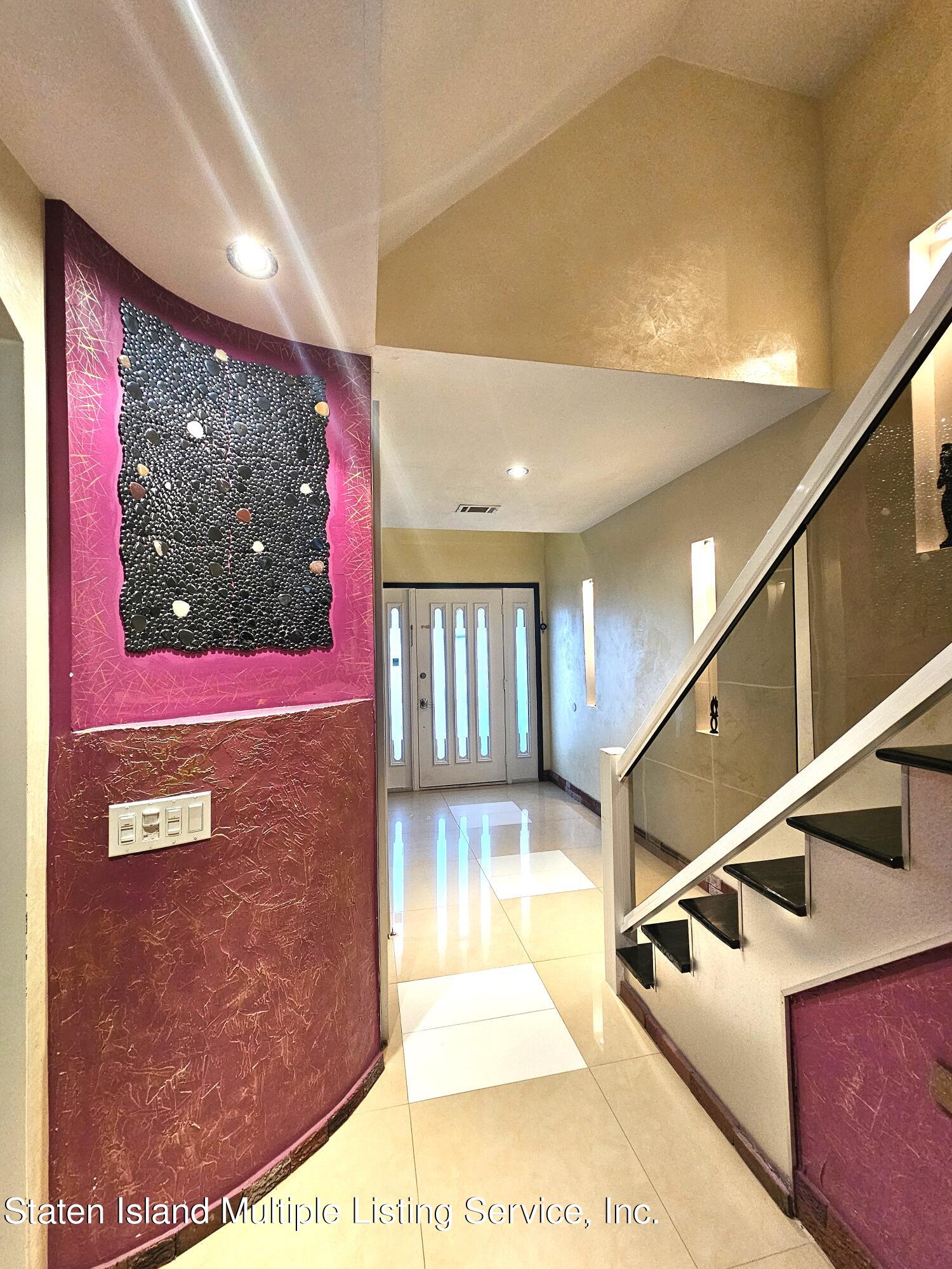 142 Commodore Drive Staten Island, NY 10309 - Photo 4 of 26 a view of entryway a hall with front door