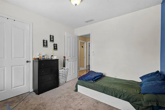 a living room with a bed and furniture